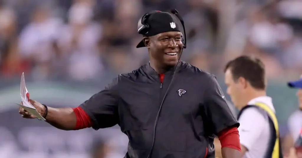 Rams coach Raheem Morris on the sidelines during a game, showcasing his strategic prowess and leadership skills.